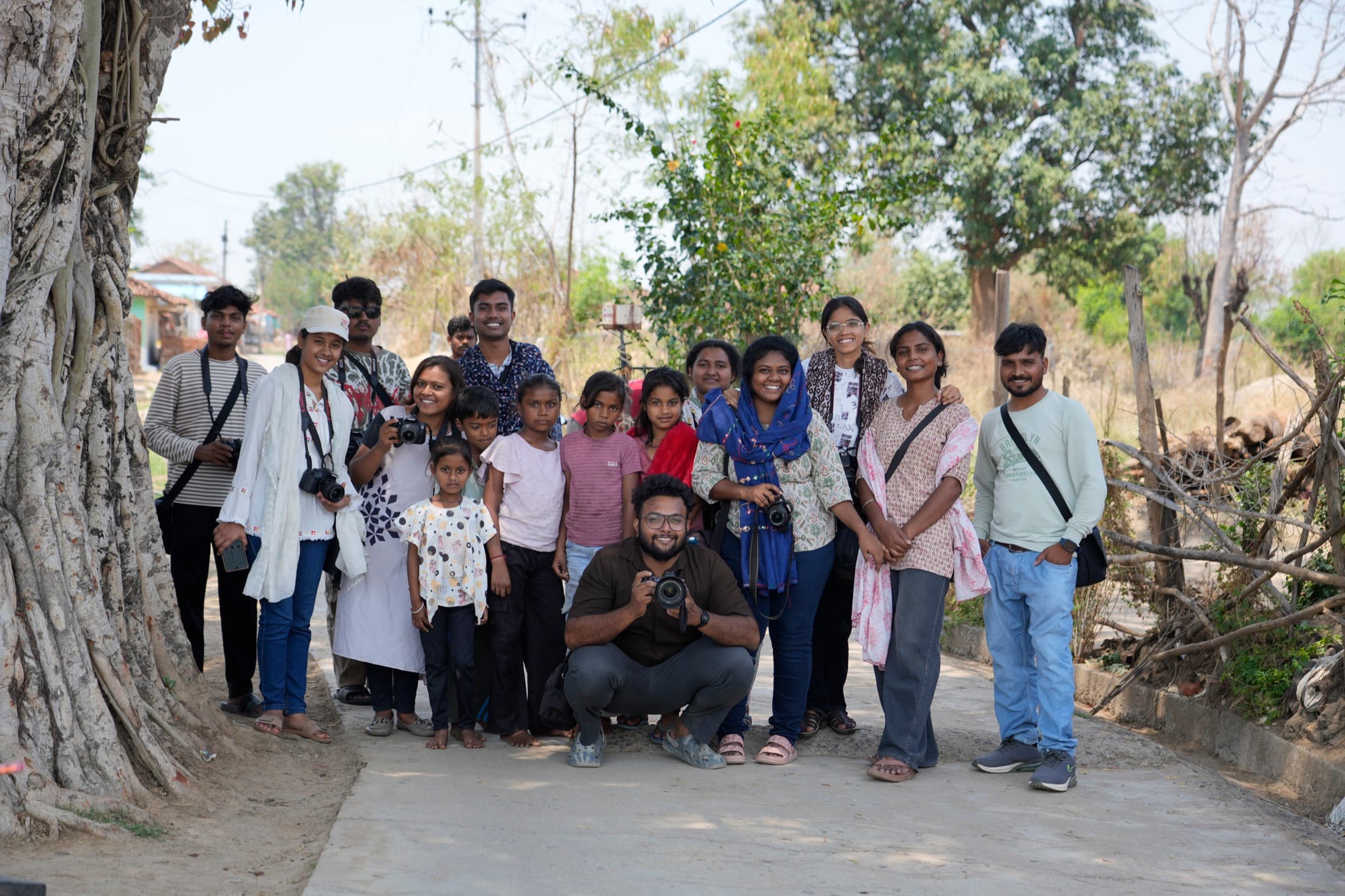 Young participant holding a camera during a CICADA workshop